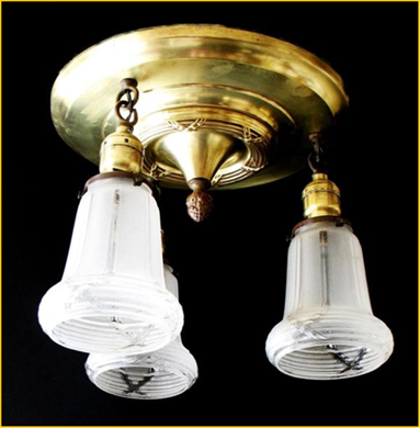 Title: Brass Pan style ceiling fixture - Description: Flush mount three light antique ceiling fixture with round glass ceiling pan and drop shdes. X pattern in body is repeated in frosted, pressed glass shades. Circa 1910.