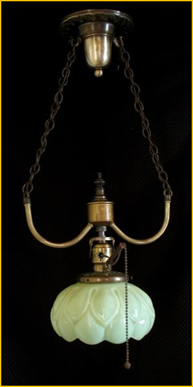 Title: Antique Light Fixture - Description: Brass entry pendant with large yellow vaseline glass flower form shade, circa 1910.